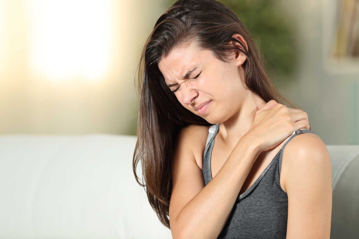 A person holding her shoulder, Back-to-School