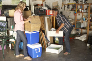 Preventing Back Injuries, Strains, or Pain During Spring Activities, A man and woman packing storage boxes