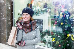 A person holding a bag, snow, Christmas decorations