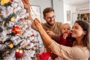 A family decorating a christmas tree, Manage Holiday Stress & Experience Rejuvenation at Carolina Rehab and Physical Medicine Center