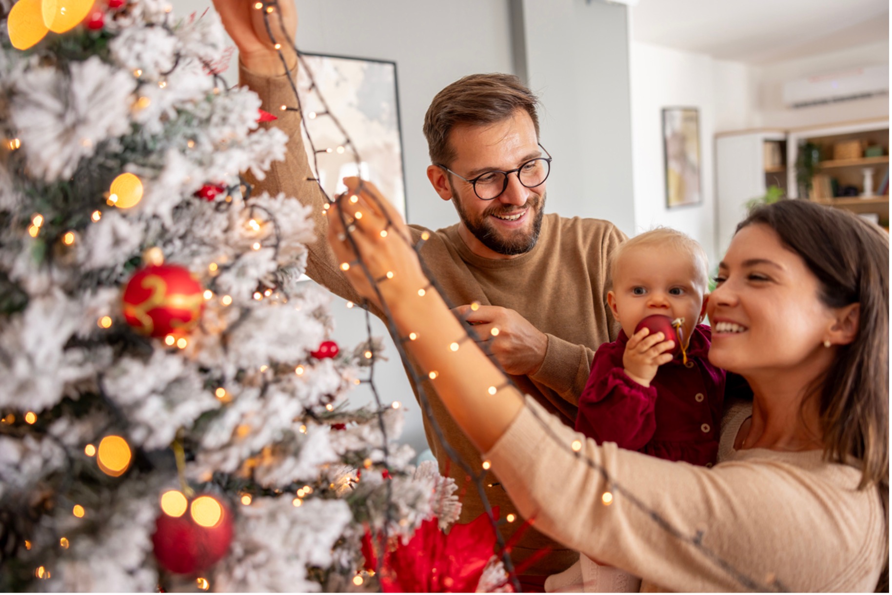 A family decorating a christmas tree, Manage Holiday Stress & Experience Rejuvenation at Carolina Rehab and Physical Medicine Center