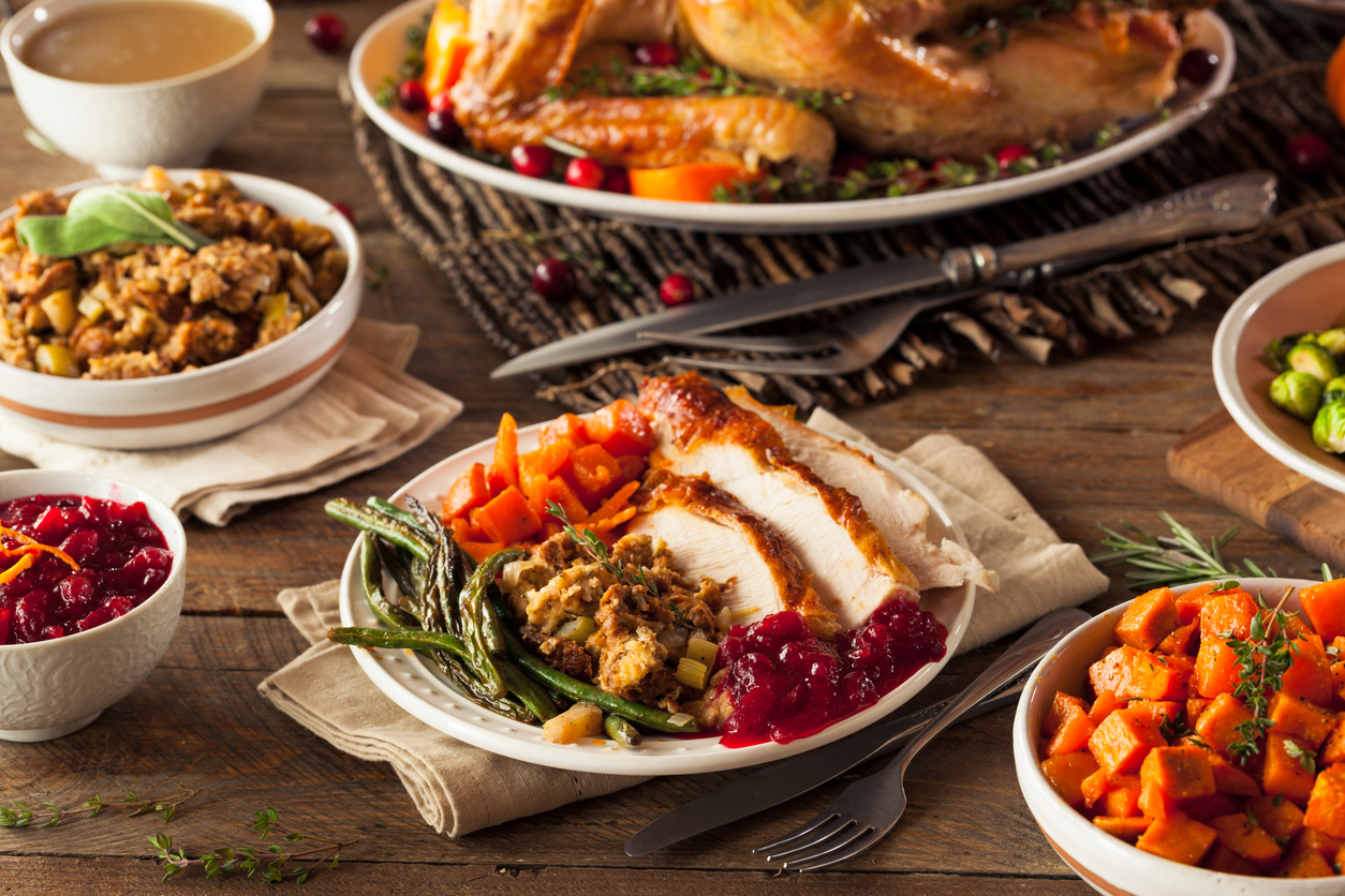 Full Homemade Thanksgiving Dinner with Turkey Stuffing Veggies and Potatos, holiday survival tips for a healthy spine