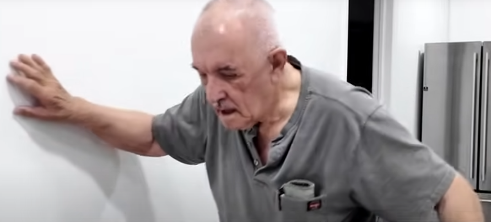 non-surgical neuropathy treatment, An elderly person leaning up against a wall