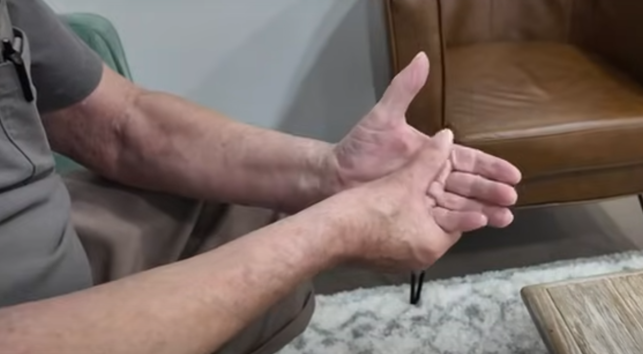 Non-Surgical Neuropathy Treatment: Finding Relief Without Surgery, A person holding their hand in pain