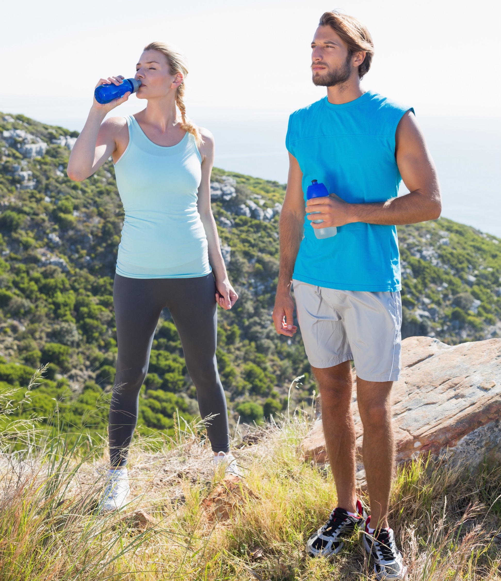 Two people outdoors holding/drinking water, Water and Your Spinal Health