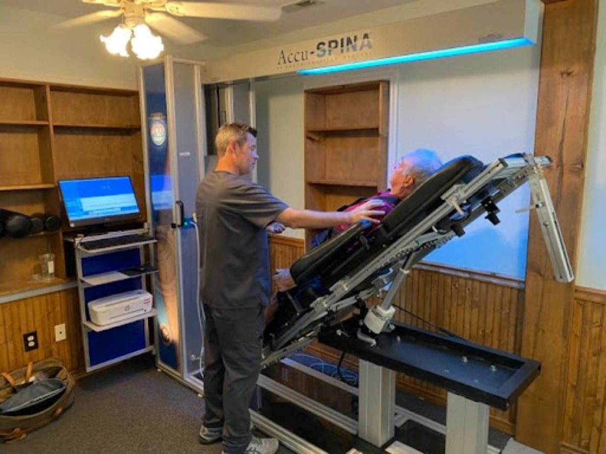 Dr. Strickland providing spinal decompression therapy to a patient at Carolina Rehab and Physical Medicine Center.
